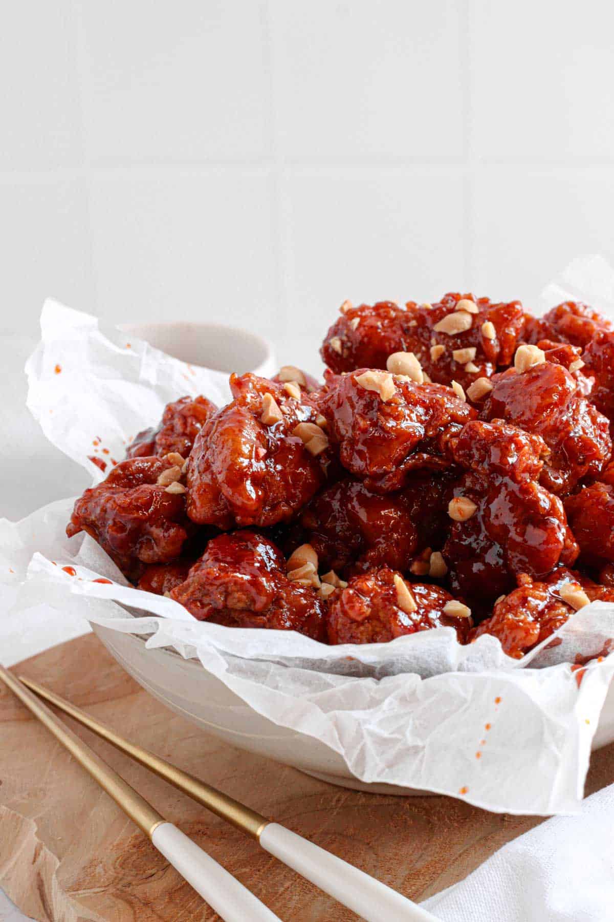 spicy Korean fried chicken is double deep fried and glazed with a sweet and spicy