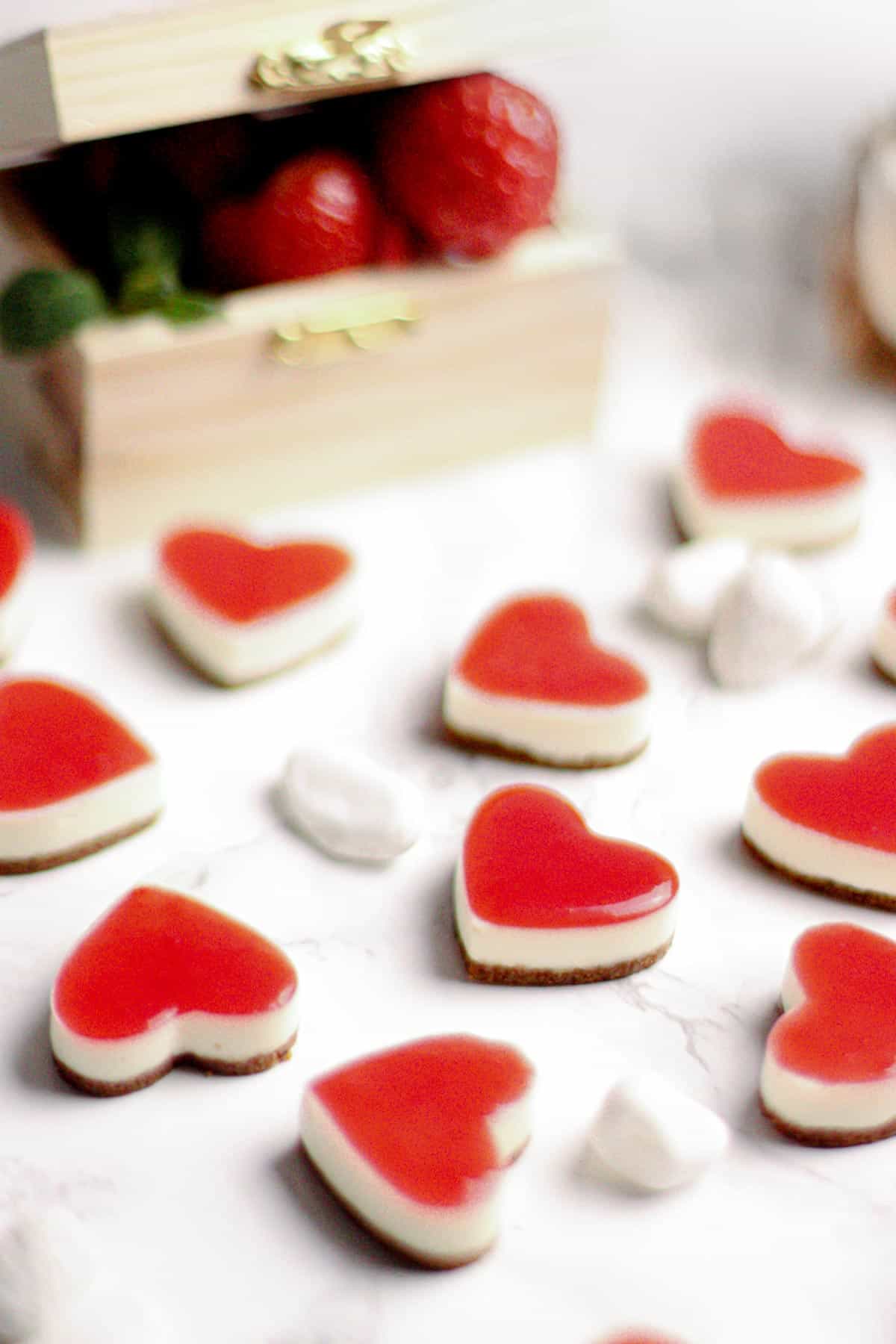cheesecake mini bite size, super smooth and silky with a crunchy speculoos biscuit base and a sweet strawberry coulis