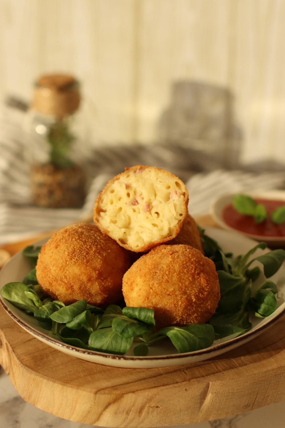 macaroni croquettes balls with ham and cheese mixed with pasta rolled into a ball then fried