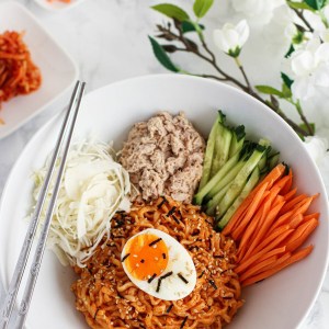 buldak instant noodles used to make a stunning bibim guksu (Korean spicy cold noodles) in less than 20 minutes! Instant ramen are mixed in a cold and spicy sauce and served with tuna and crunchy vegetables