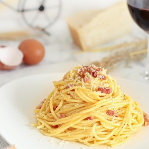 spaghetti carbonara Italian recipe with eggs, parmesan and pancetta in a plate.