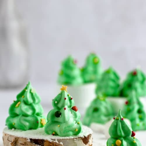christmas tree meringue on a table with a snow background.