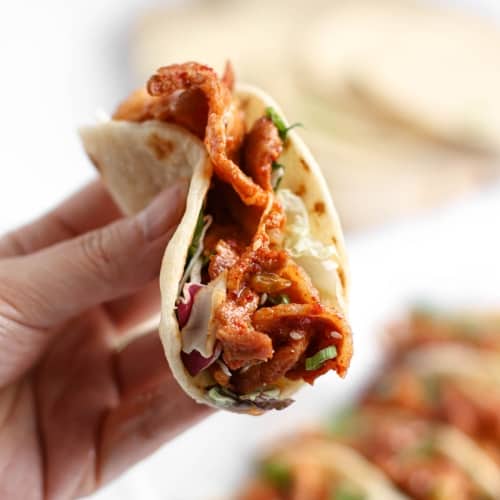 mini tacos filled with a juicy Korean spicy pork marinated in a gochugaru sauce