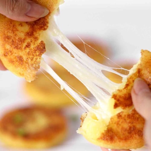 korean potato pancakes with stretchy cheese inside.