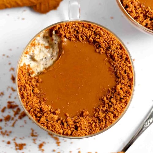 cup filled with banana biscoff overnight oats.