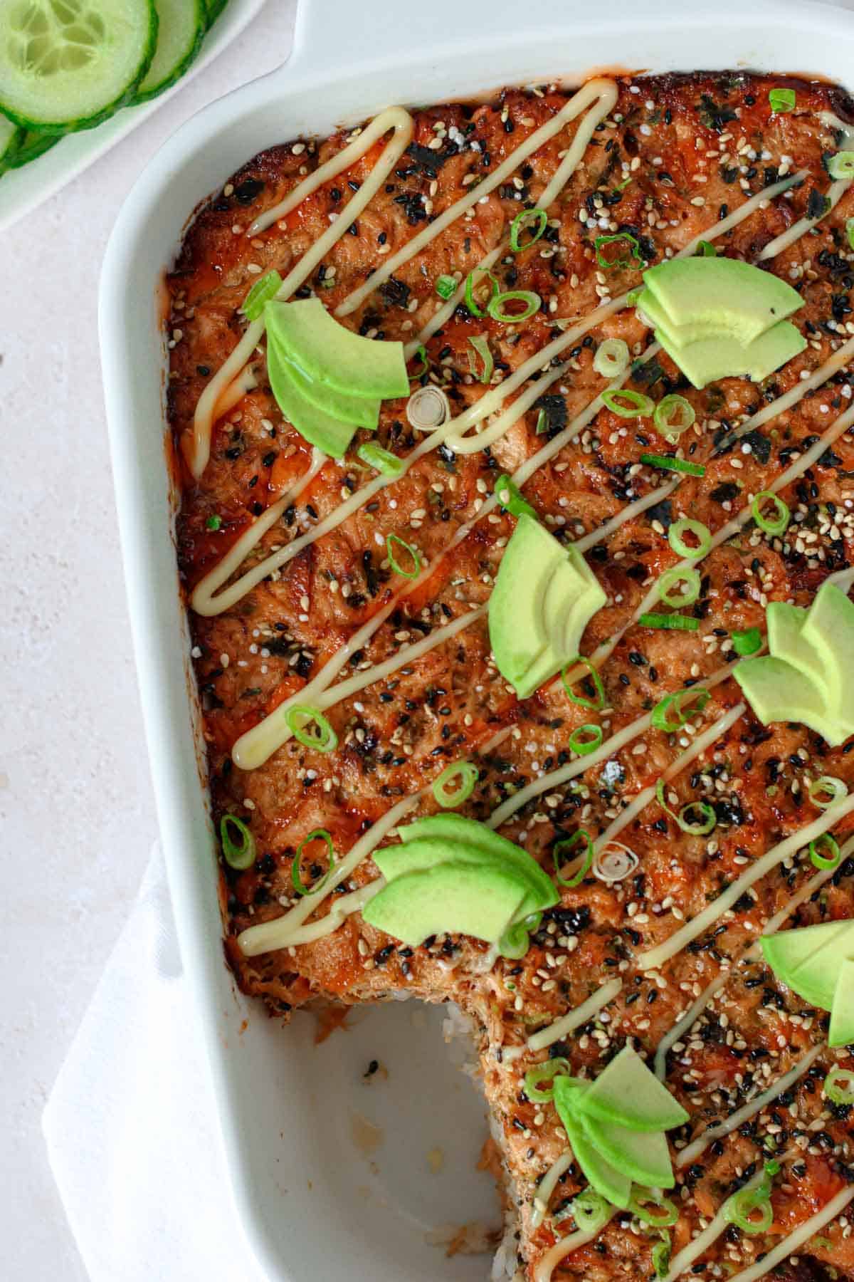 a dish with salmon sushi bake