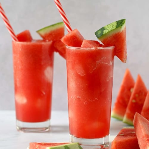 two glasses filled with frozen watermelon juice korean style