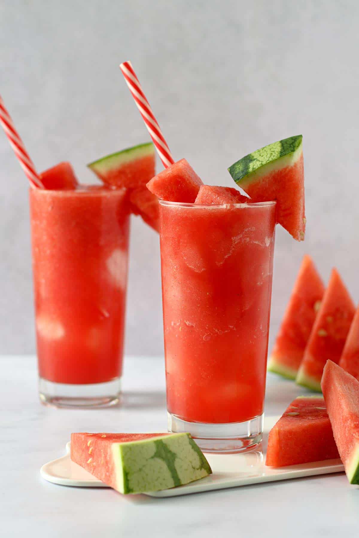 two glasses filled with frozen watermelon juice korean style