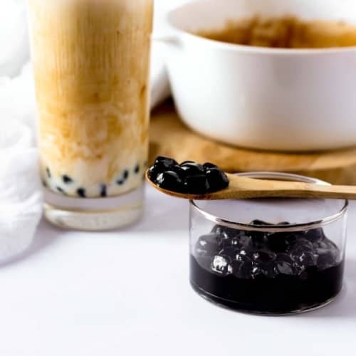 a pin showing a bubble tea and some homemade boba pearls
