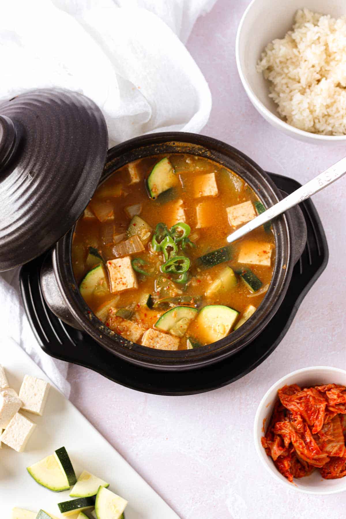 a Korean stone bowl with soybean paste stew