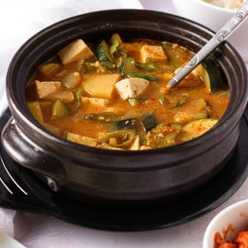 a Korean stone bowl with doenjang jjigae