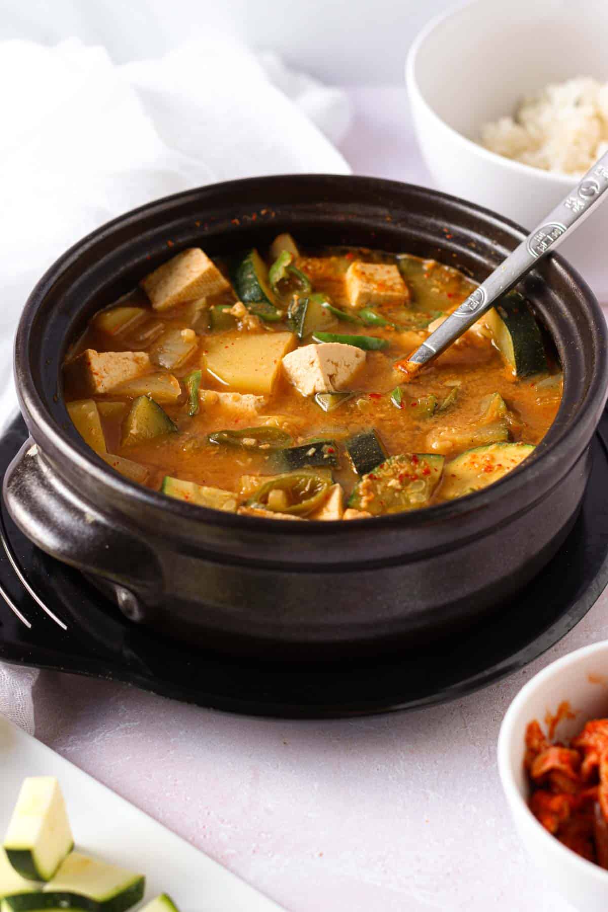 a Korean stone bowl with doenjang jjigae