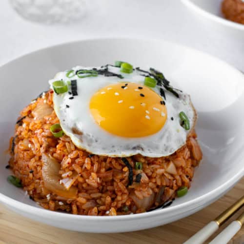 kimchi fried rice dome with a fried egg on top.