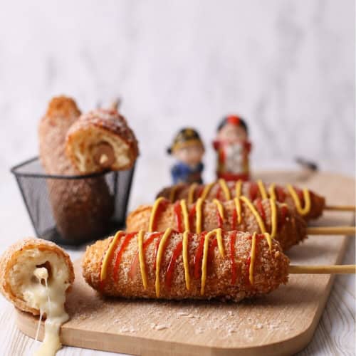 korean corn dogs with melting cheese inside.
