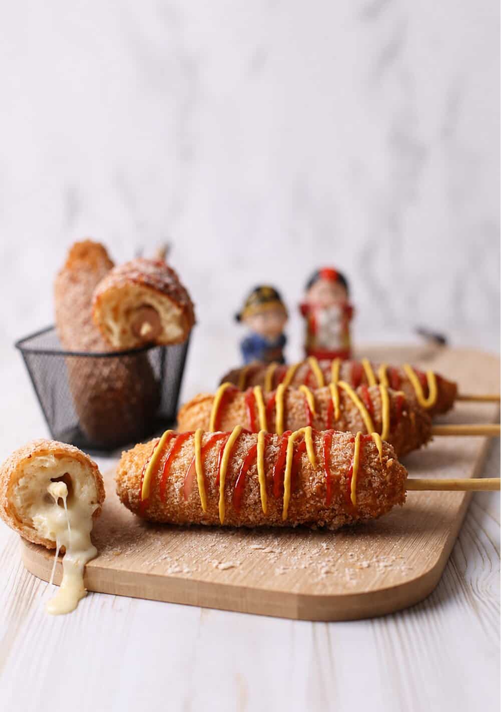 korean corn dogs with melting cheese inside.